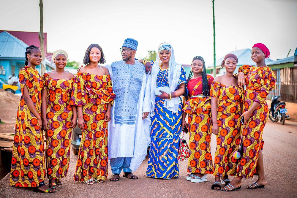 Bride and family in matching cloth at an outdooring
